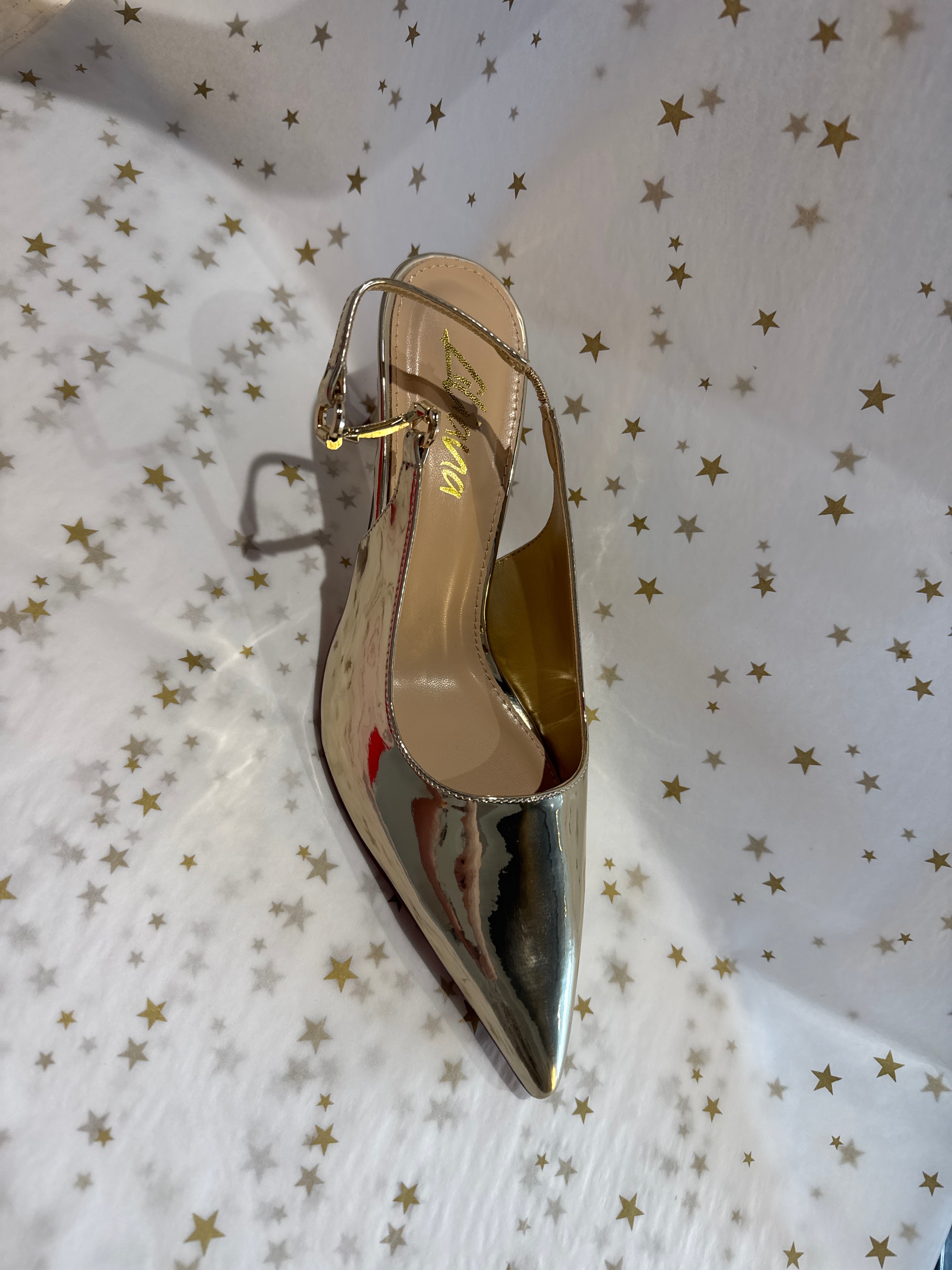 Gold slingback kitten heel.
