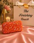 Orange sequin clutch bag