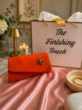 Orange envelope clutch