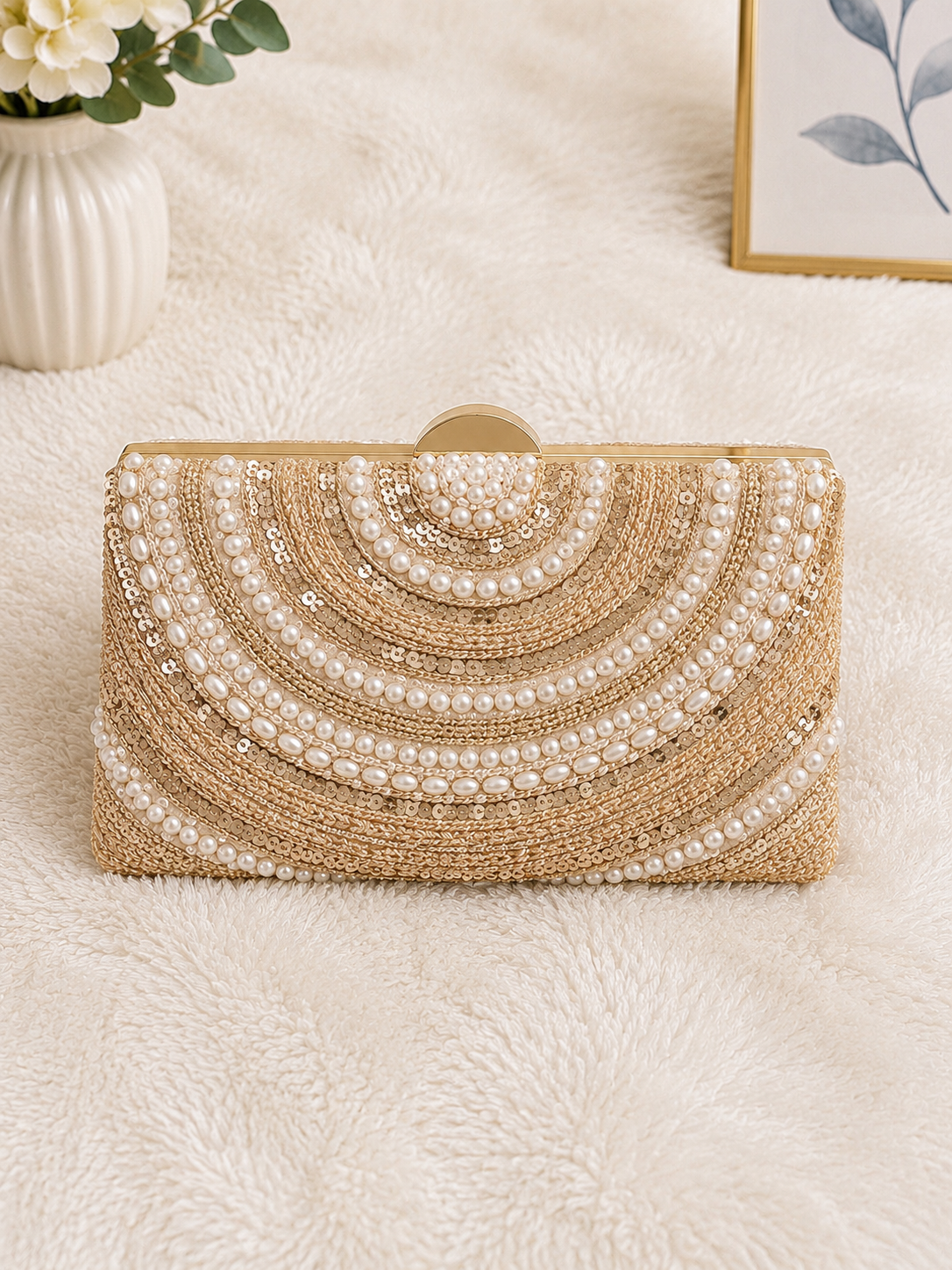 Gold sequin and pearl clutch bag