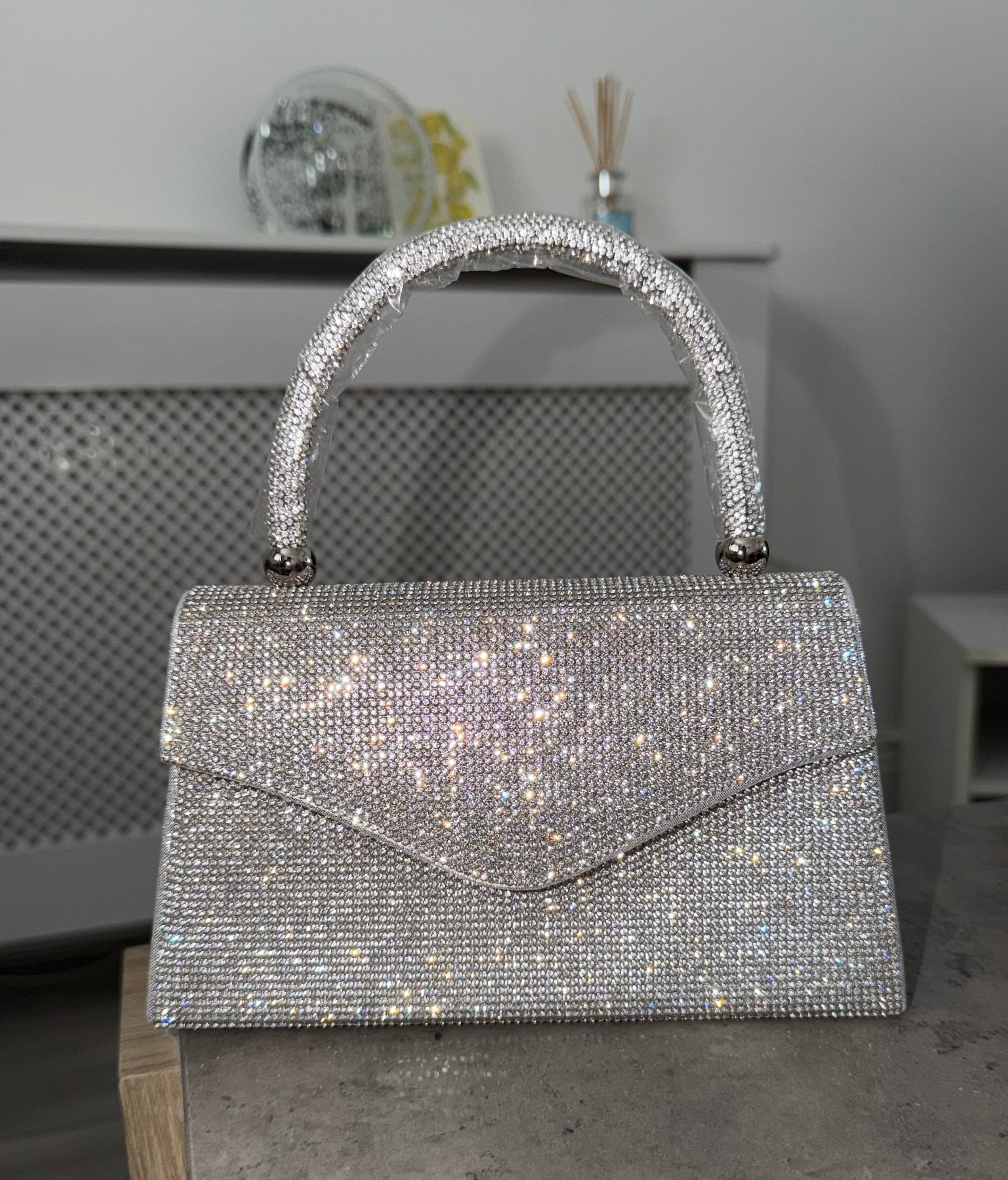 Rhinestone detailed clutch handbag