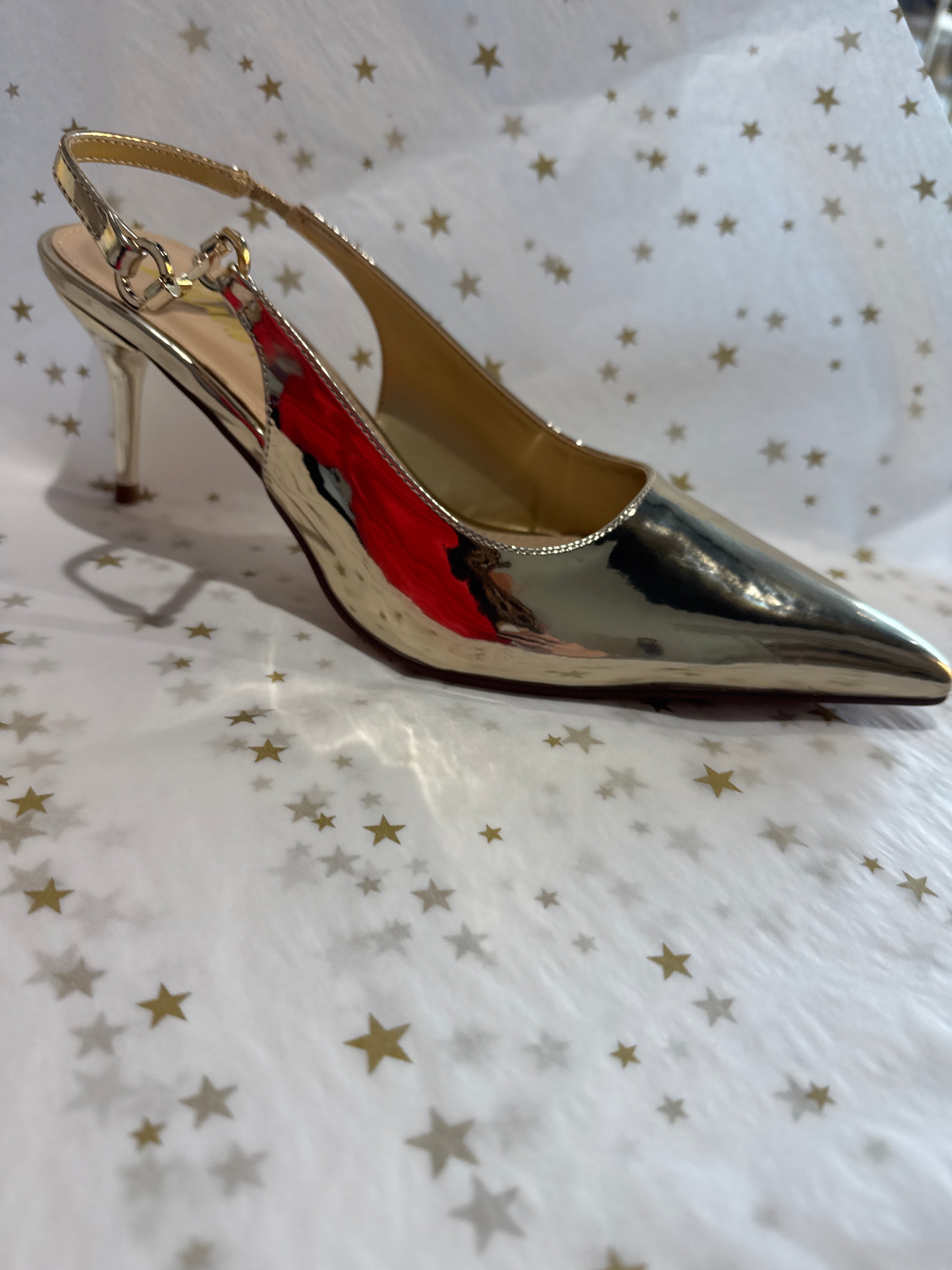 Gold slingback kitten heel.