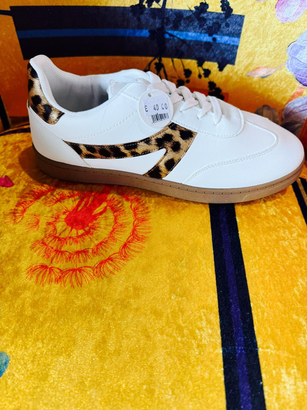 White trainer with leopard print detail