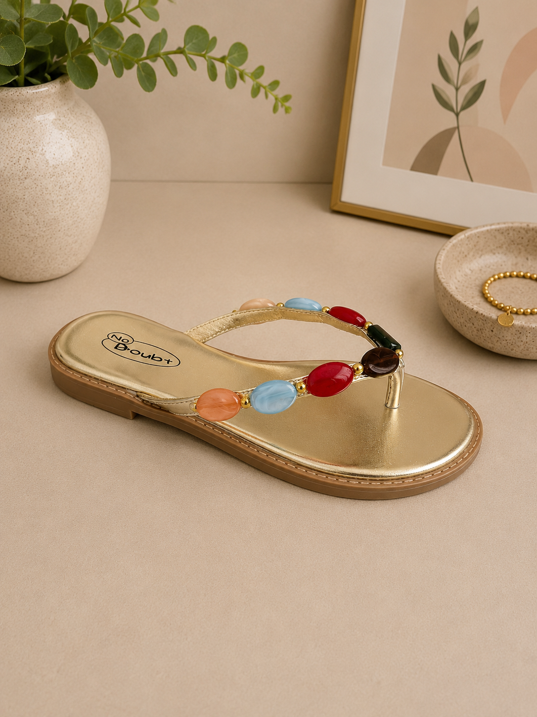 Gem embellished gold flip flop